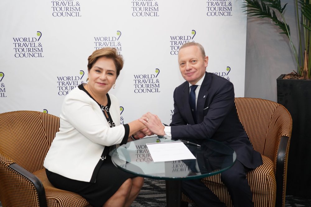 Brett-Tollman-Signing-the-Climate-Change-Declaration-on-Behalf-of-TTC-with-Patricia-Espinosa